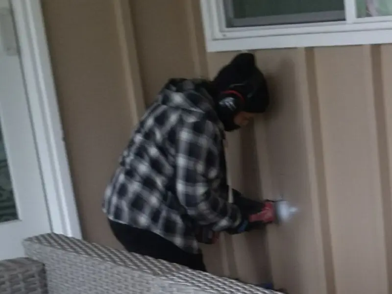 Professional electrician installing an exterior outlet in Eldersburg