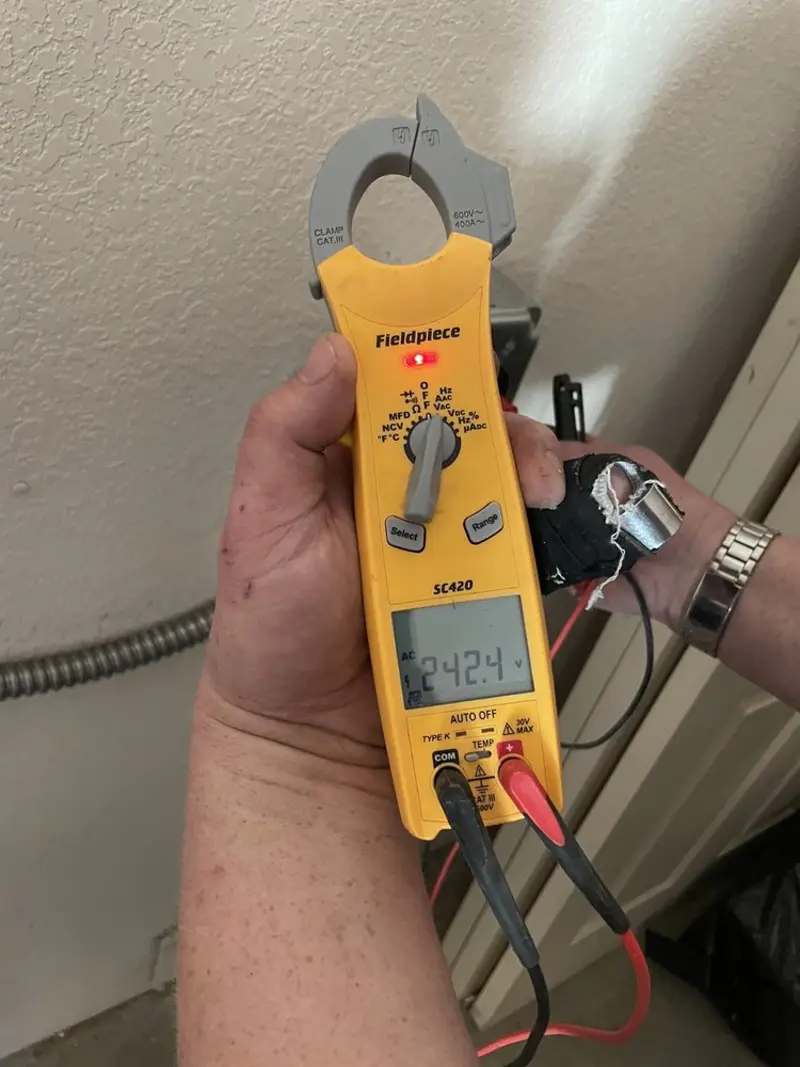 Voltage testing with clamp meter during Recessed Lighting Installation in Eldersburg
